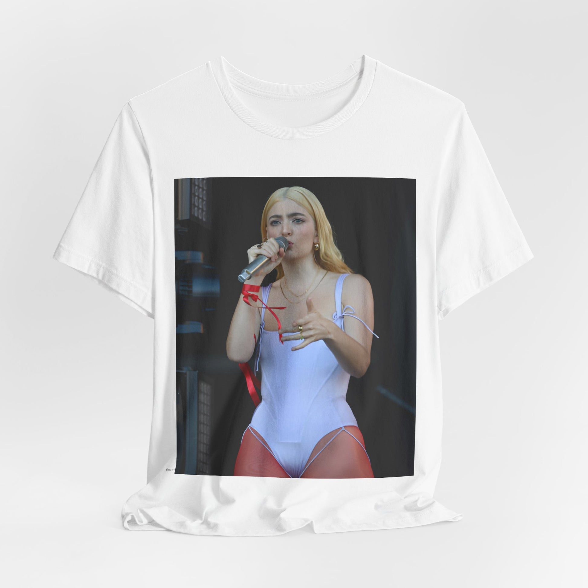 A black graphic t-shirt featuring a graphic or photo of Lorde performing on stage in a cool alternative music style.