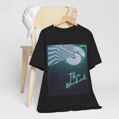 A black graphic t-shirt featuring a vintage concert graphic of The Weeknd from his 'Kiss Land' era.