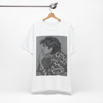A black graphic t-shirt featuring a graphic of George Michael from his 80s Wham! era.