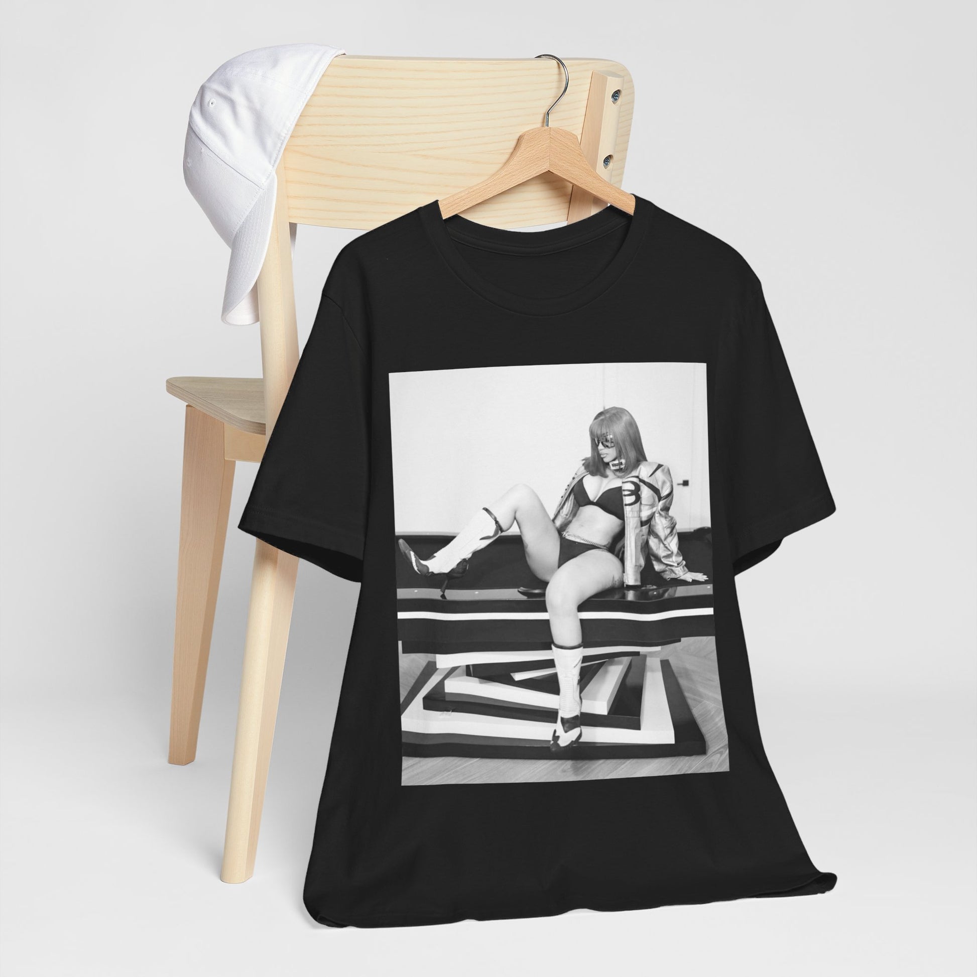 A black graphic t-shirt featuring an artistic or aesthetic graphic of Cardi B in a hip hop style.