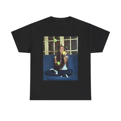 A black graphic t-shirt featuring a candid photo of Alanis Morissette sitting on a couch, looking relaxed or thoughtful.