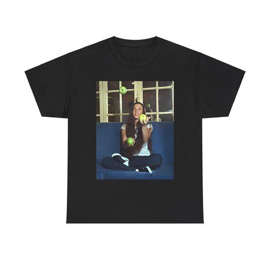 A black graphic t-shirt featuring a candid photo of Alanis Morissette sitting on a couch, looking relaxed or thoughtful.