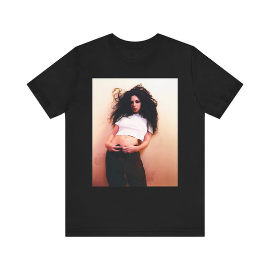 A black graphic t-shirt featuring a graphic of Charli XCX, designed with an indie pop aesthetic.