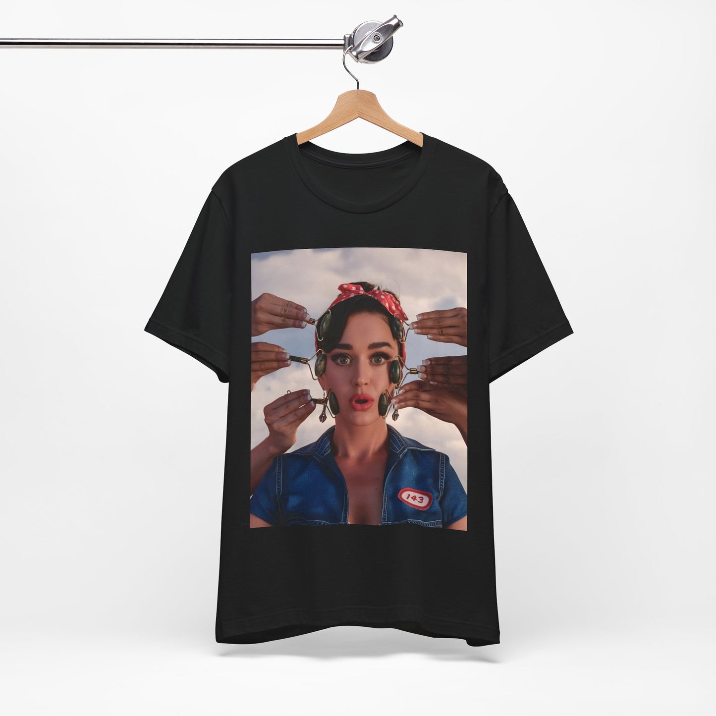 A black graphic t-shirt featuring a modern pop essential graphic of Katy Perry.