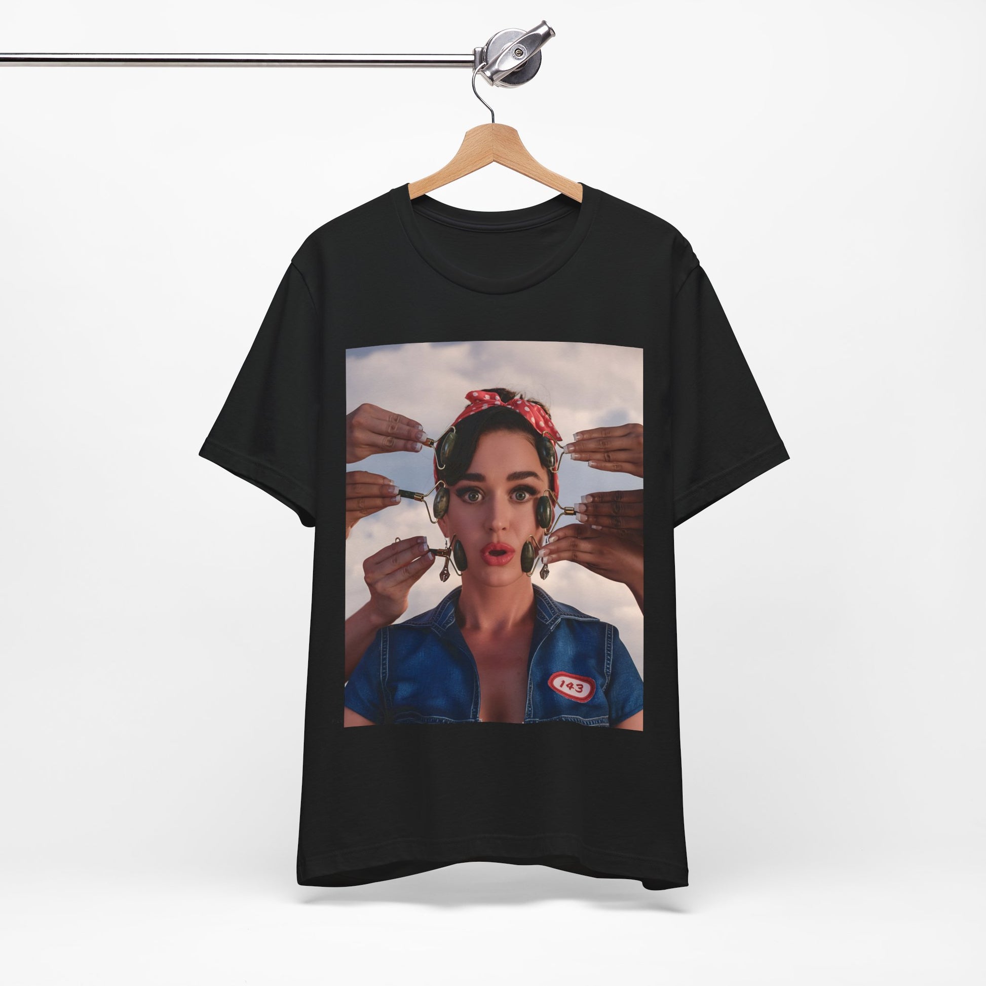 A black graphic t-shirt featuring a modern pop essential graphic of Katy Perry.