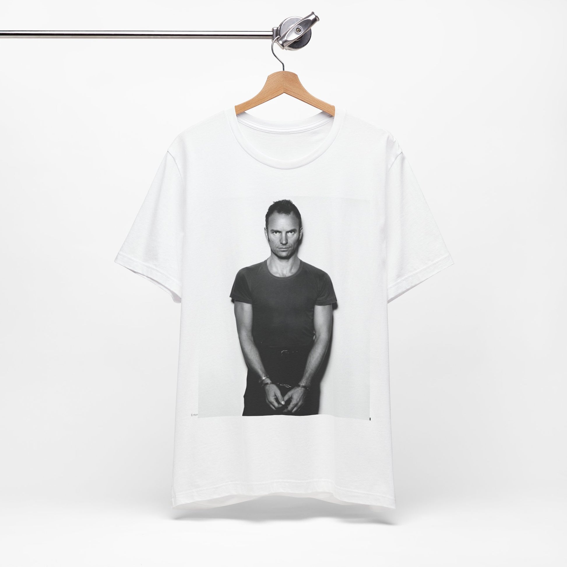 A black graphic t-shirt featuring a black and white portrait photo of Sting.