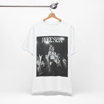 A black graphic t-shirt featuring a graphic or photo of Maneskin performing live.