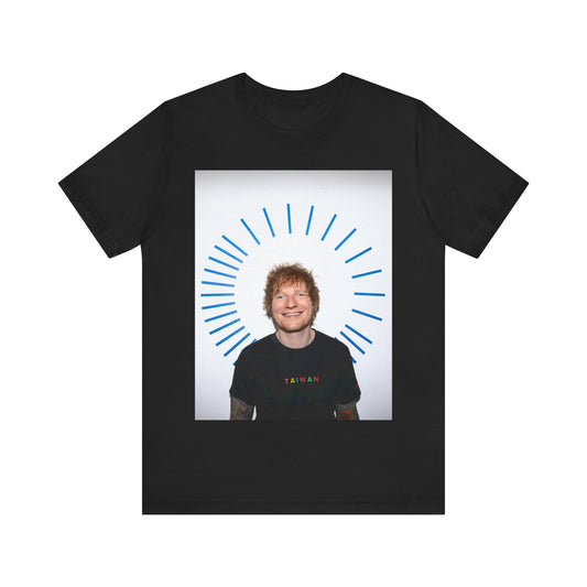 A black graphic t-shirt featuring a classic photo portrait of Ed Sheeran in a folk-pop style.