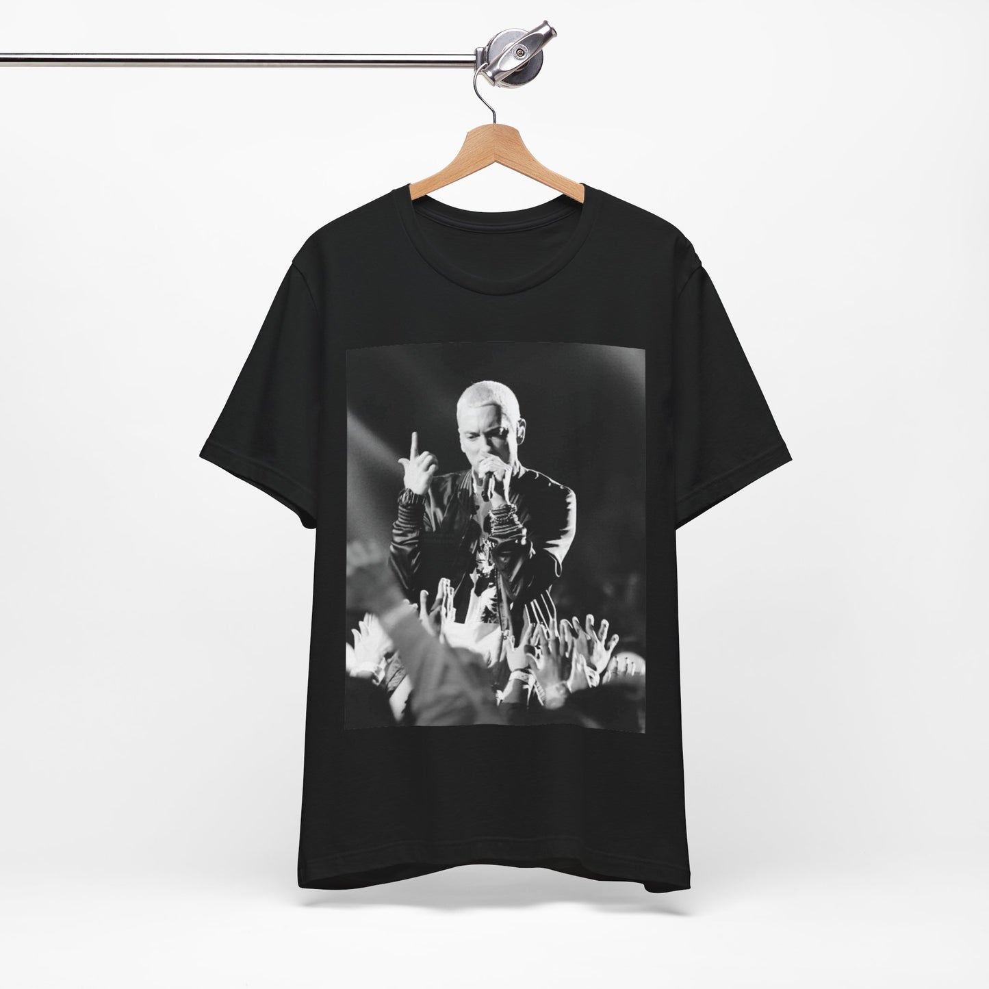 A black graphic t-shirt featuring a graphic or photo of Eminem performing live on stage.