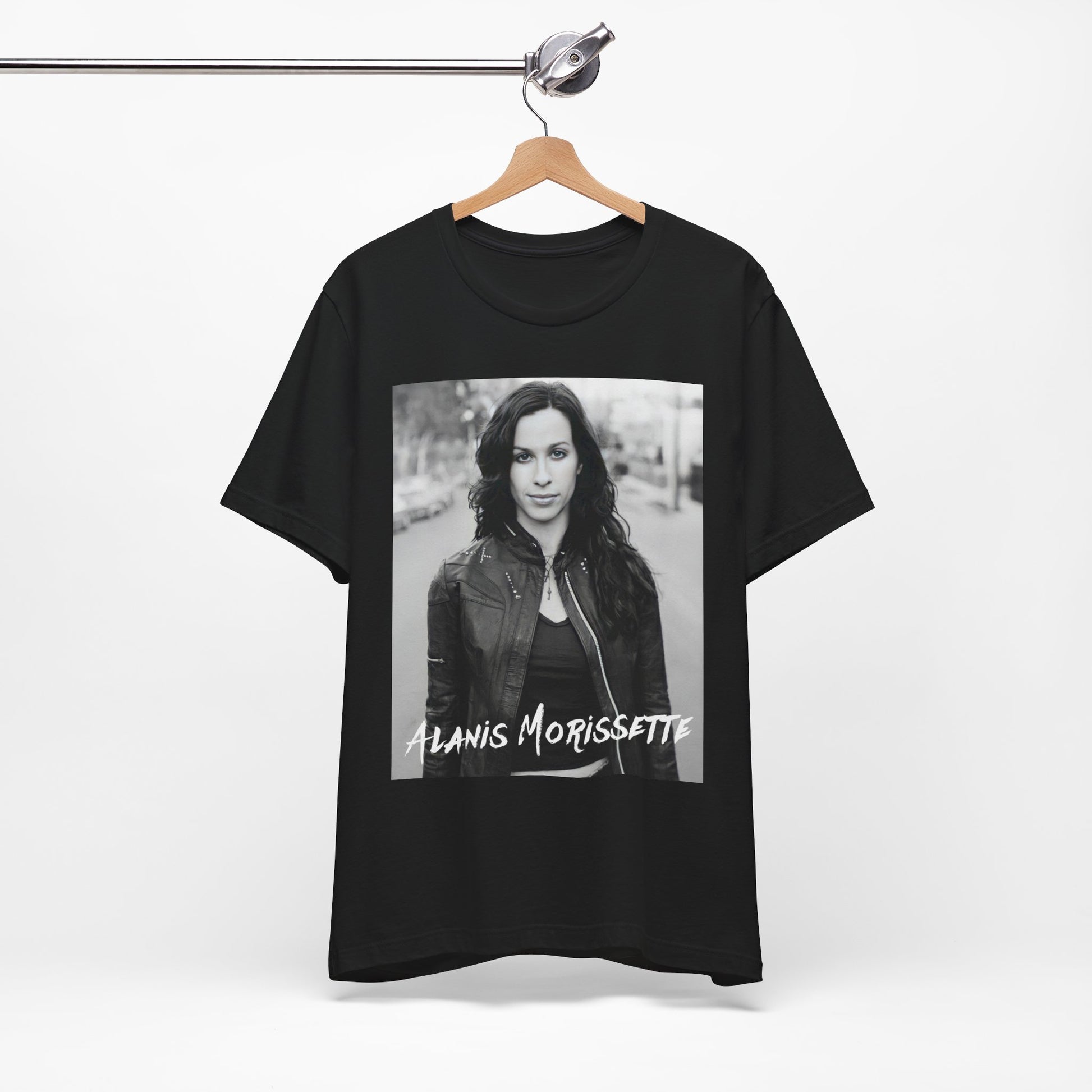A black graphic t-shirt featuring a black and white photo of Alanis Morissette from 1998, showing her with a poised or thoughtful expression.