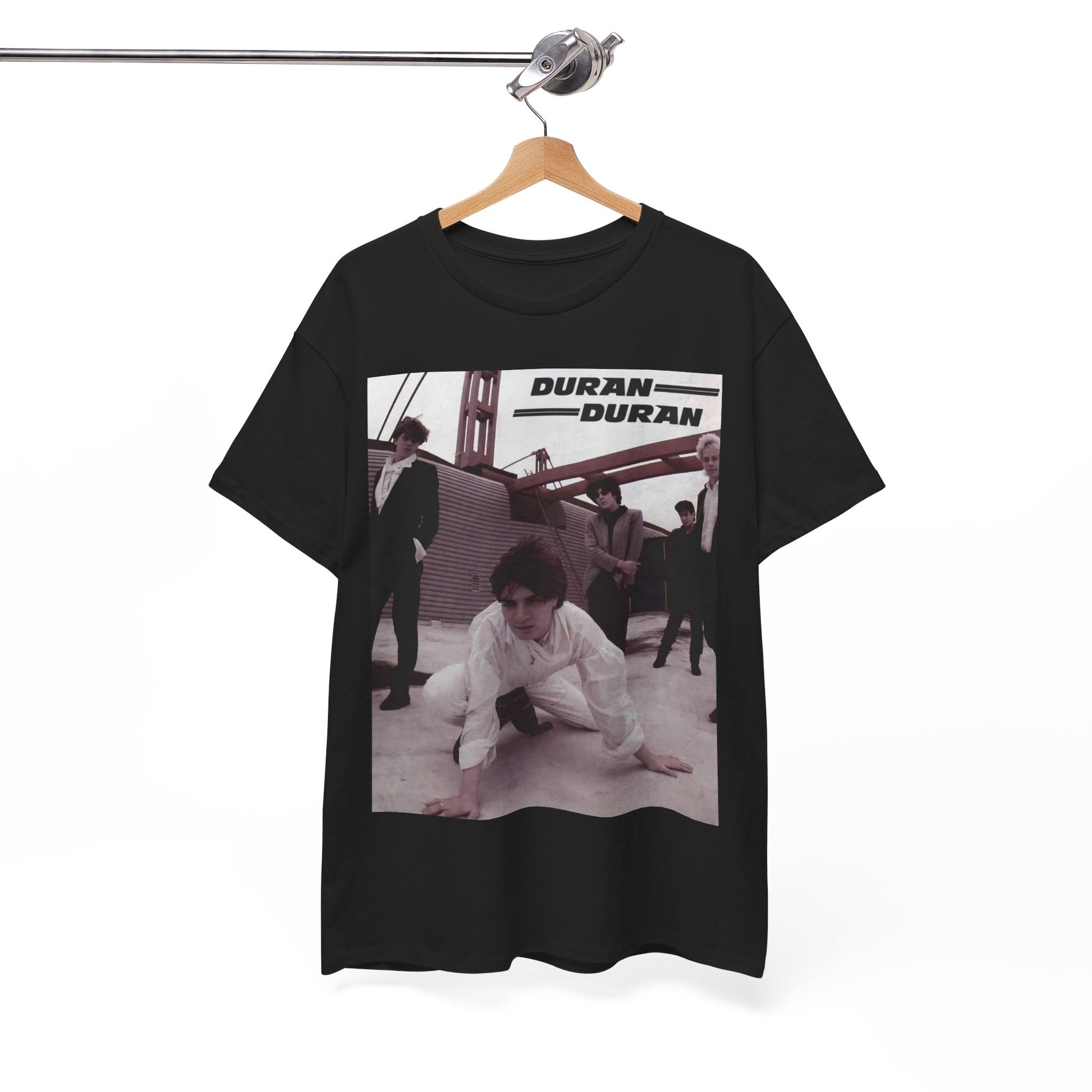 A black graphic t-shirt featuring a graphic related to Duran Duran's 'Hungry Like the Wolf' song or era.