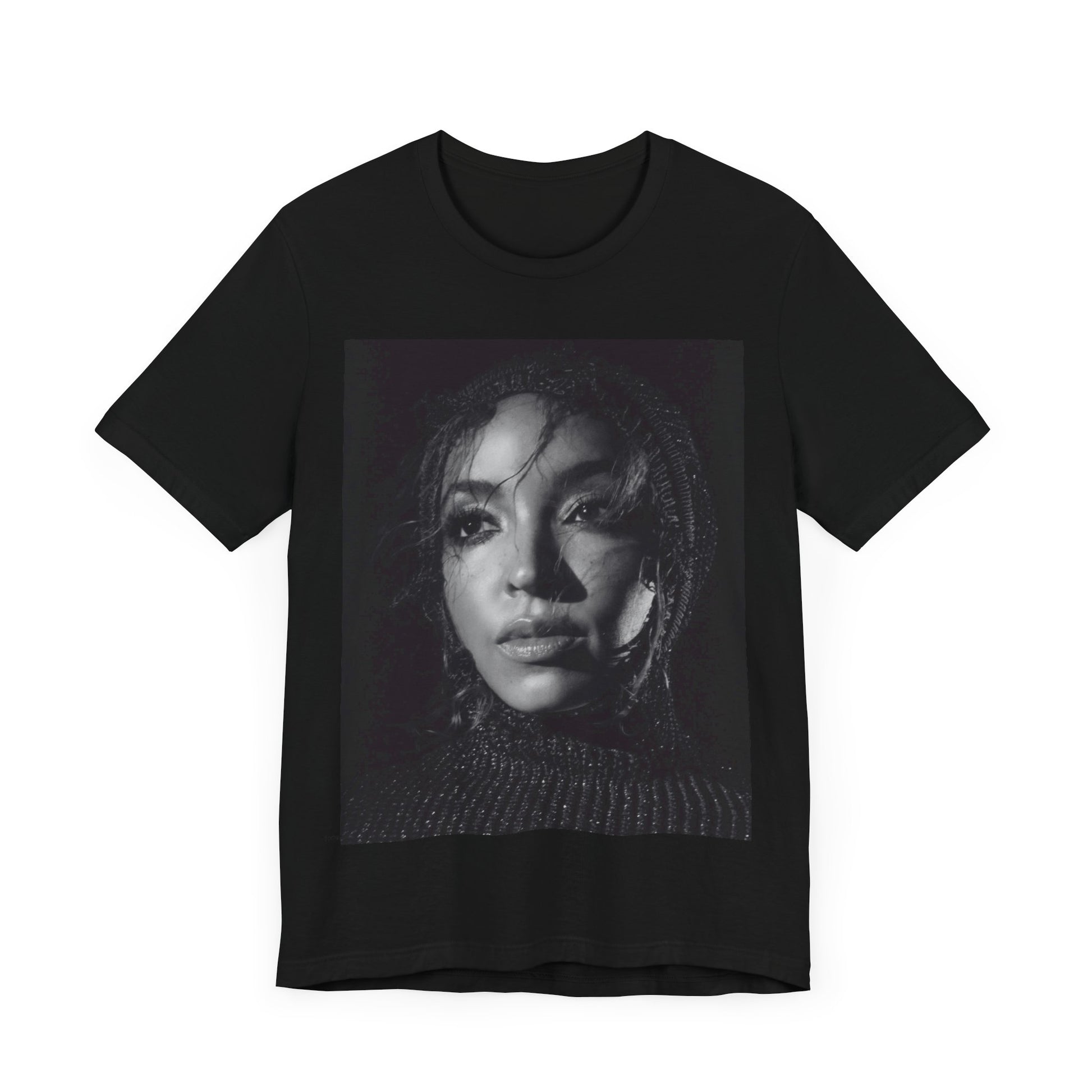 A black graphic t-shirt featuring a black and white portrait photo of Tinashe.