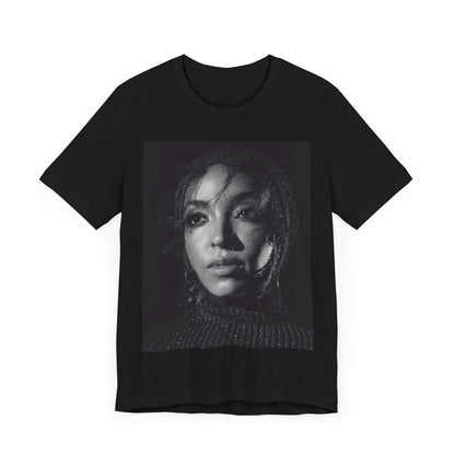 A black graphic t-shirt featuring a black and white portrait photo of Tinashe.