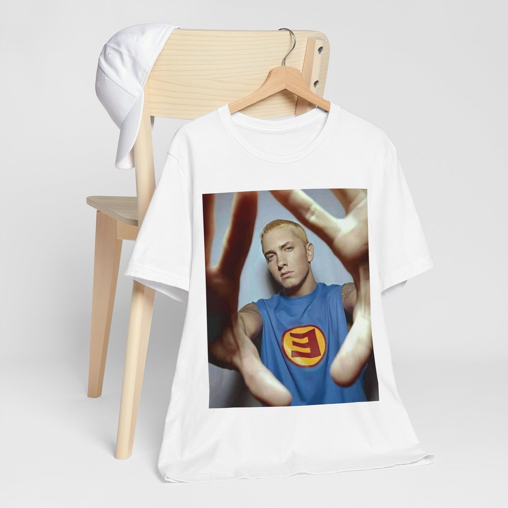 A black graphic t-shirt featuring a graphic related to Eminem's 'The Slim Shady LP' album.
