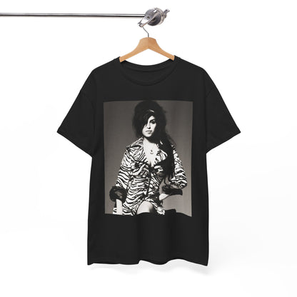 A black graphic t-shirt featuring a vintage black and white portrait of Amy Winehouse, showing her with her signature beehive and soulful expression.