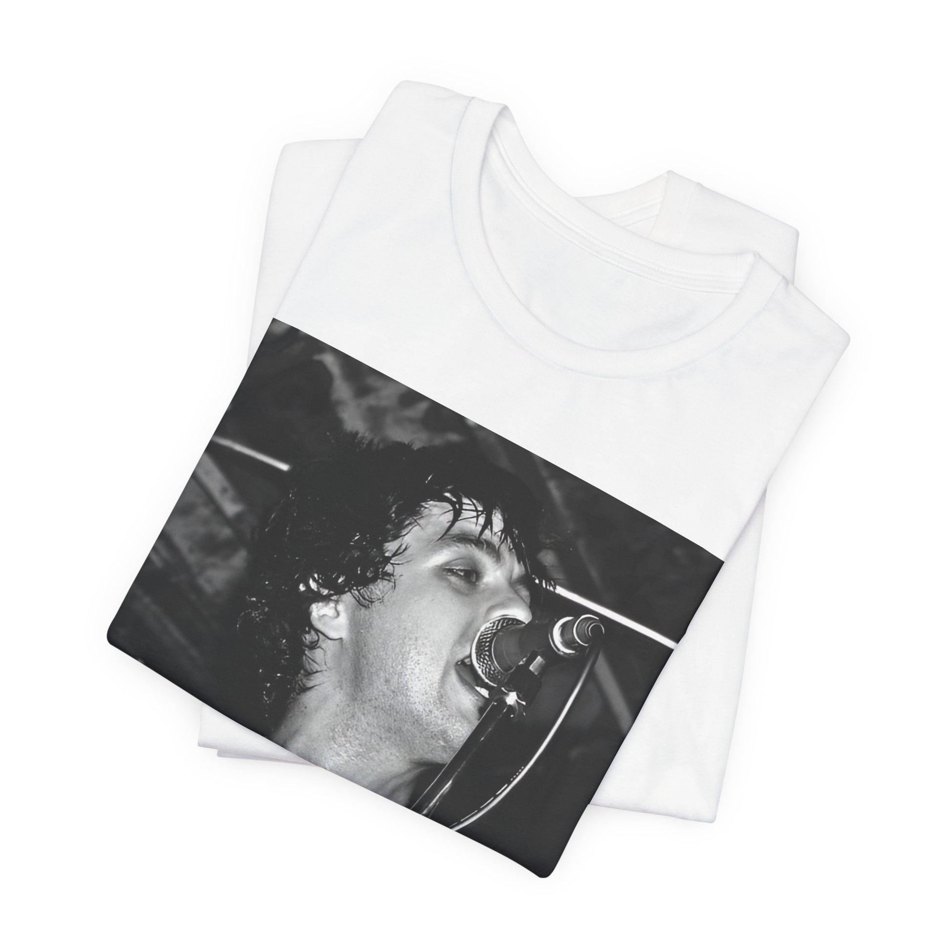 A black graphic t-shirt featuring a black and white graphic or photo of Green Day performing live on stage.