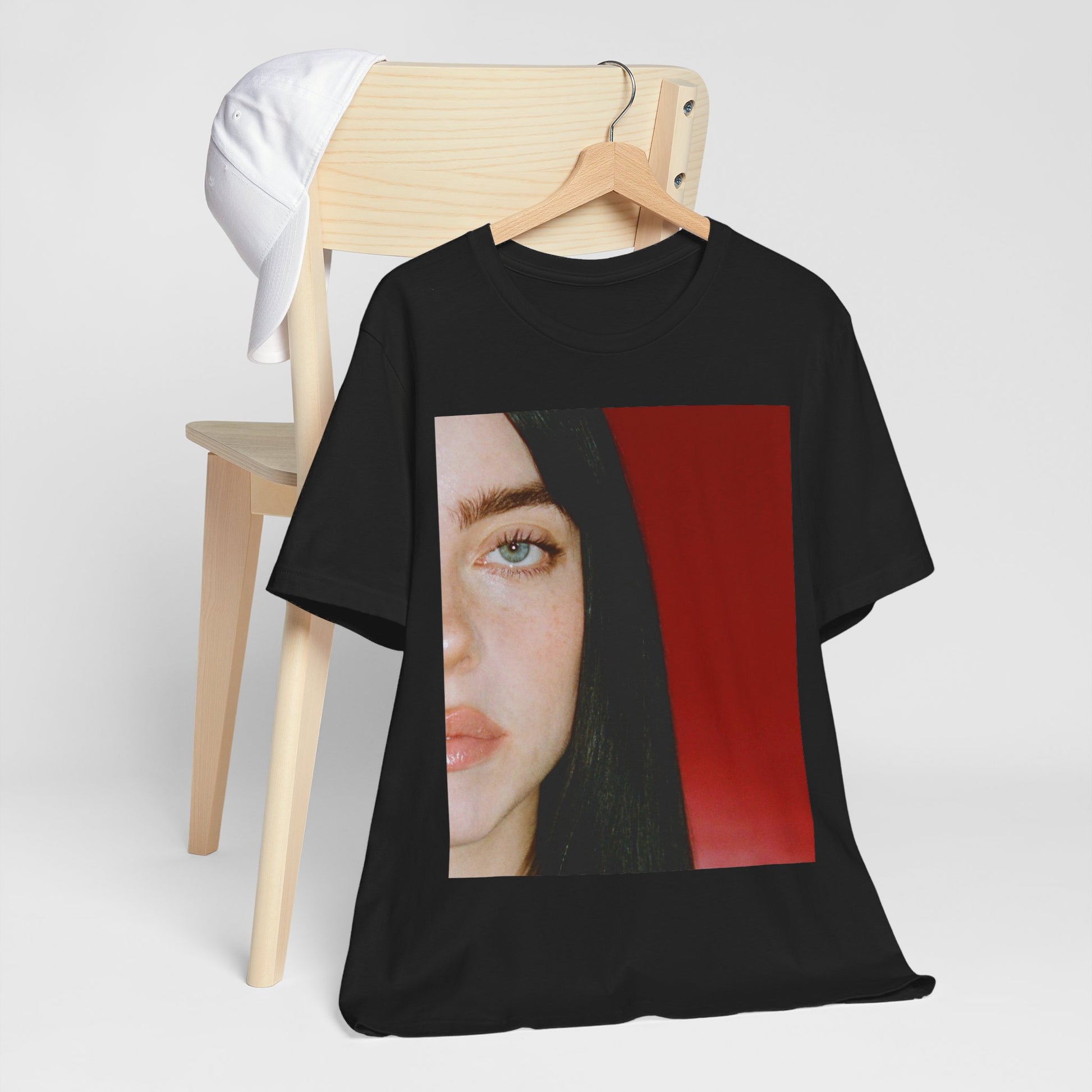 A classic, direct, black and white portrait of Billie Eilish, embodying a timeless aesthetic, printed on a graphic t-shirt.