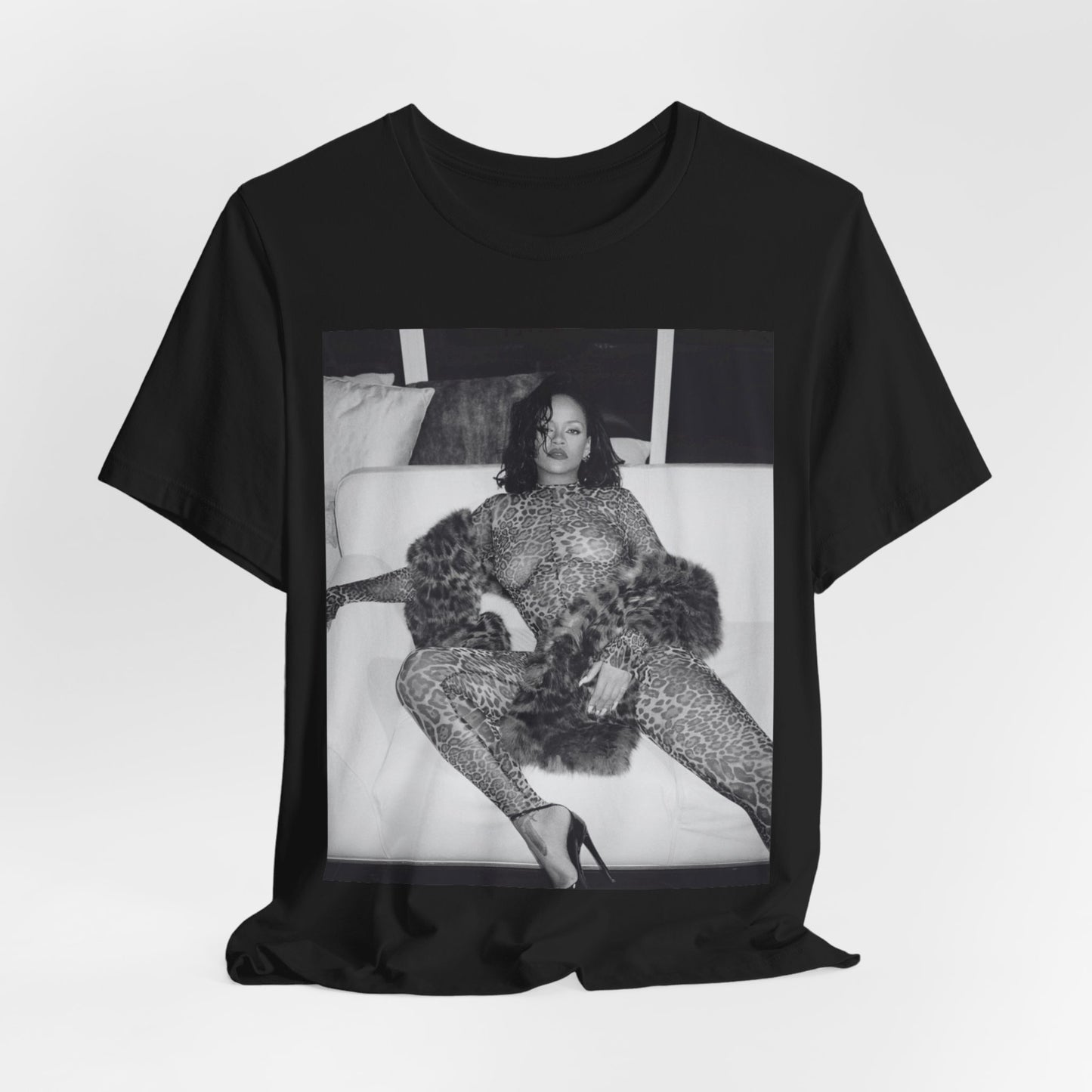 A black graphic t-shirt featuring a black and white, monochrome graphic or photo of Rihanna in a sexy pose.