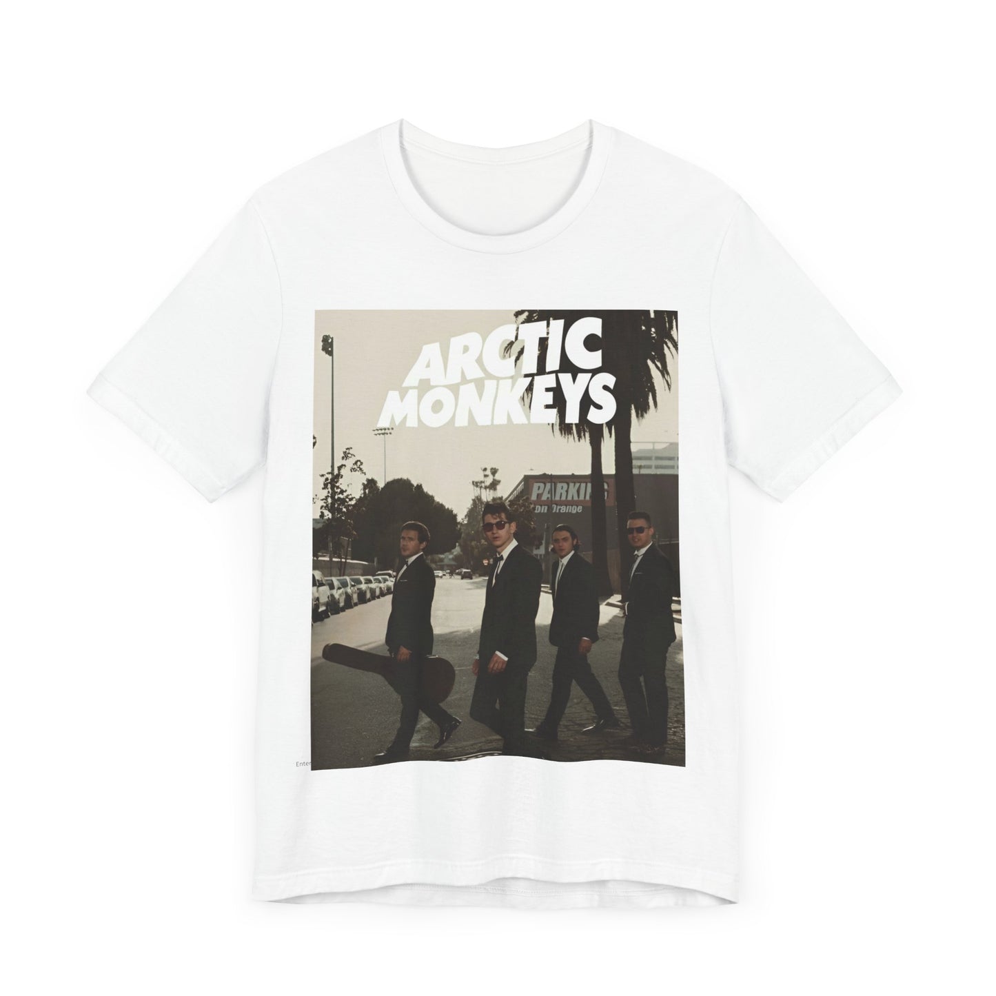 A black graphic t-shirt featuring Arctic Monkeys in a pose or setting similar to the iconic 'Abbey Road' album cover.