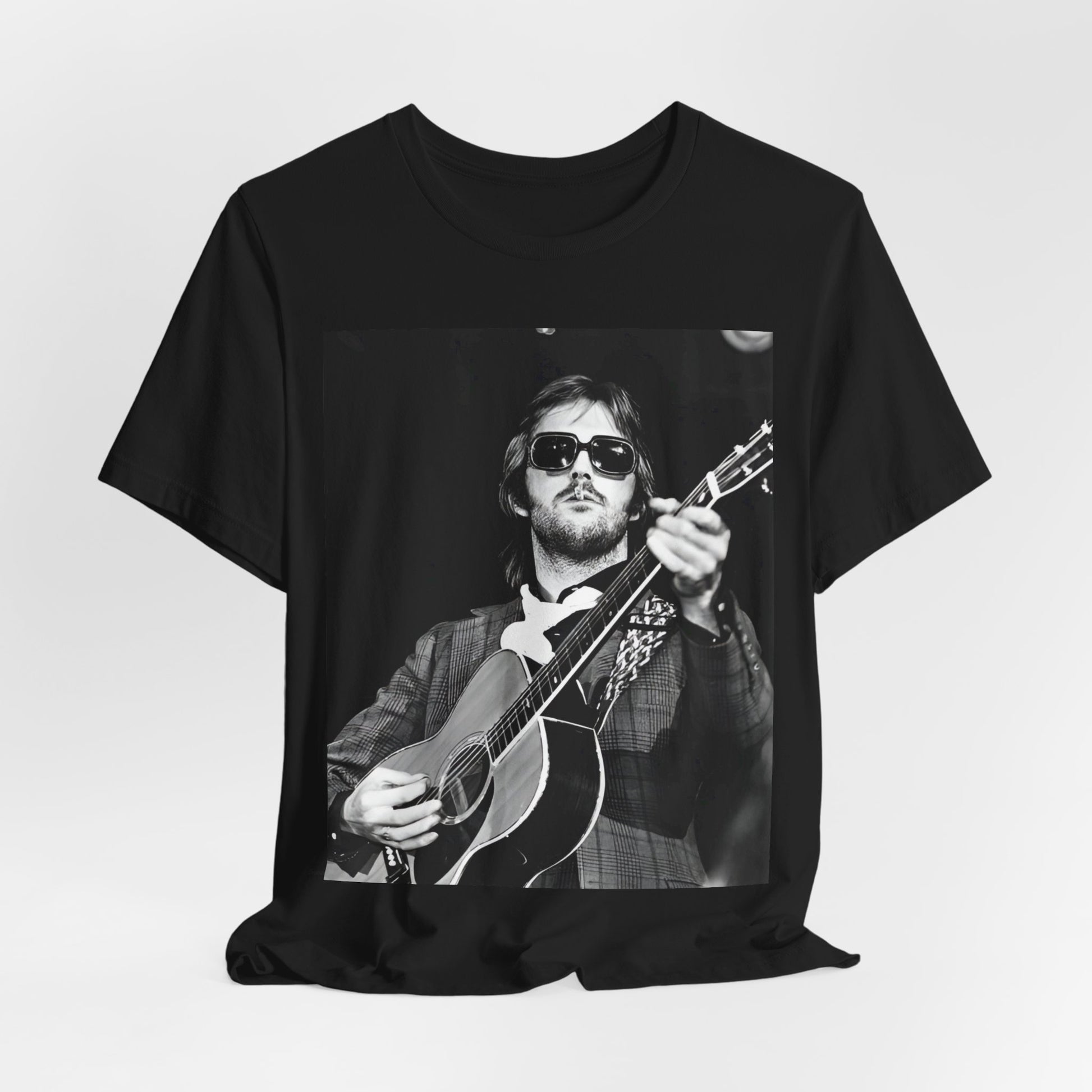 A black graphic t-shirt featuring a graphic of Eric Clapton with a chill blues rock vibe.