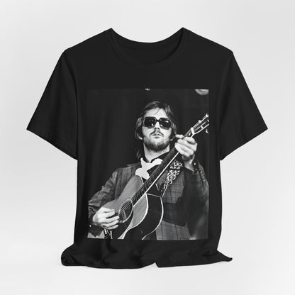 A black graphic t-shirt featuring a graphic of Eric Clapton with a chill blues rock vibe.