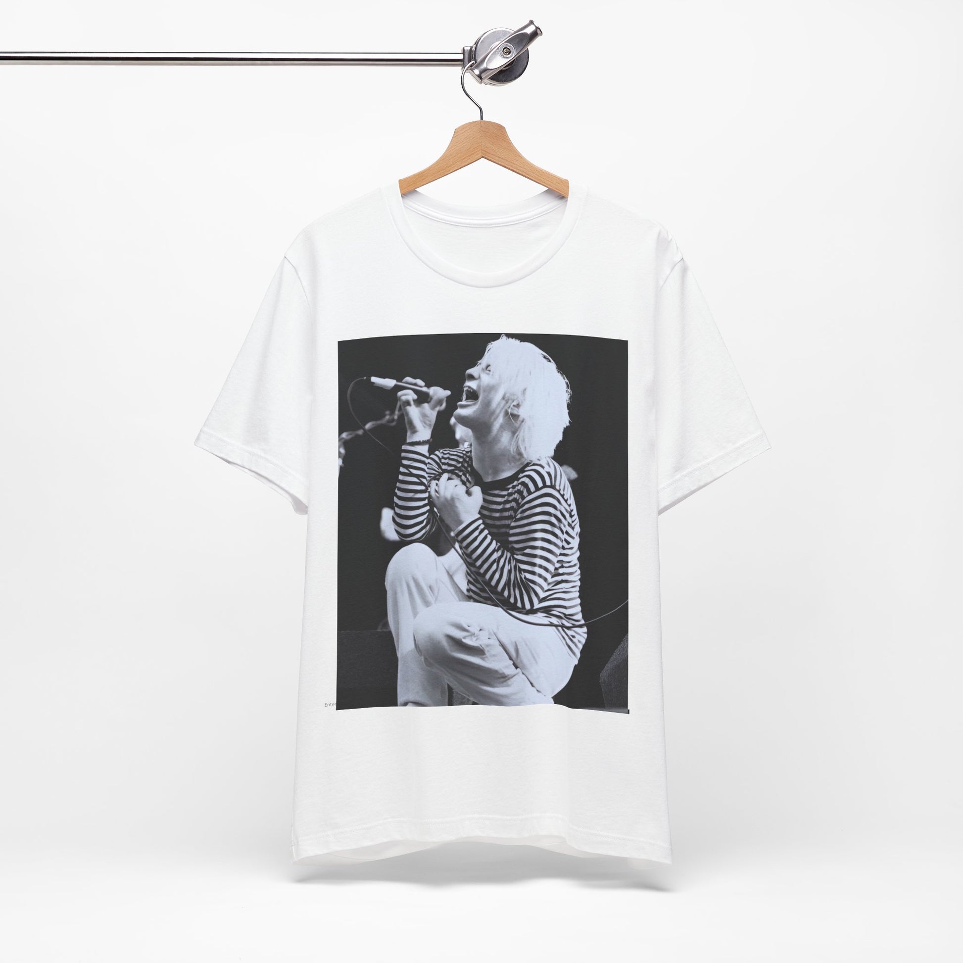 A black graphic t-shirt featuring a black and white graphic or photo of Radiohead performing live.