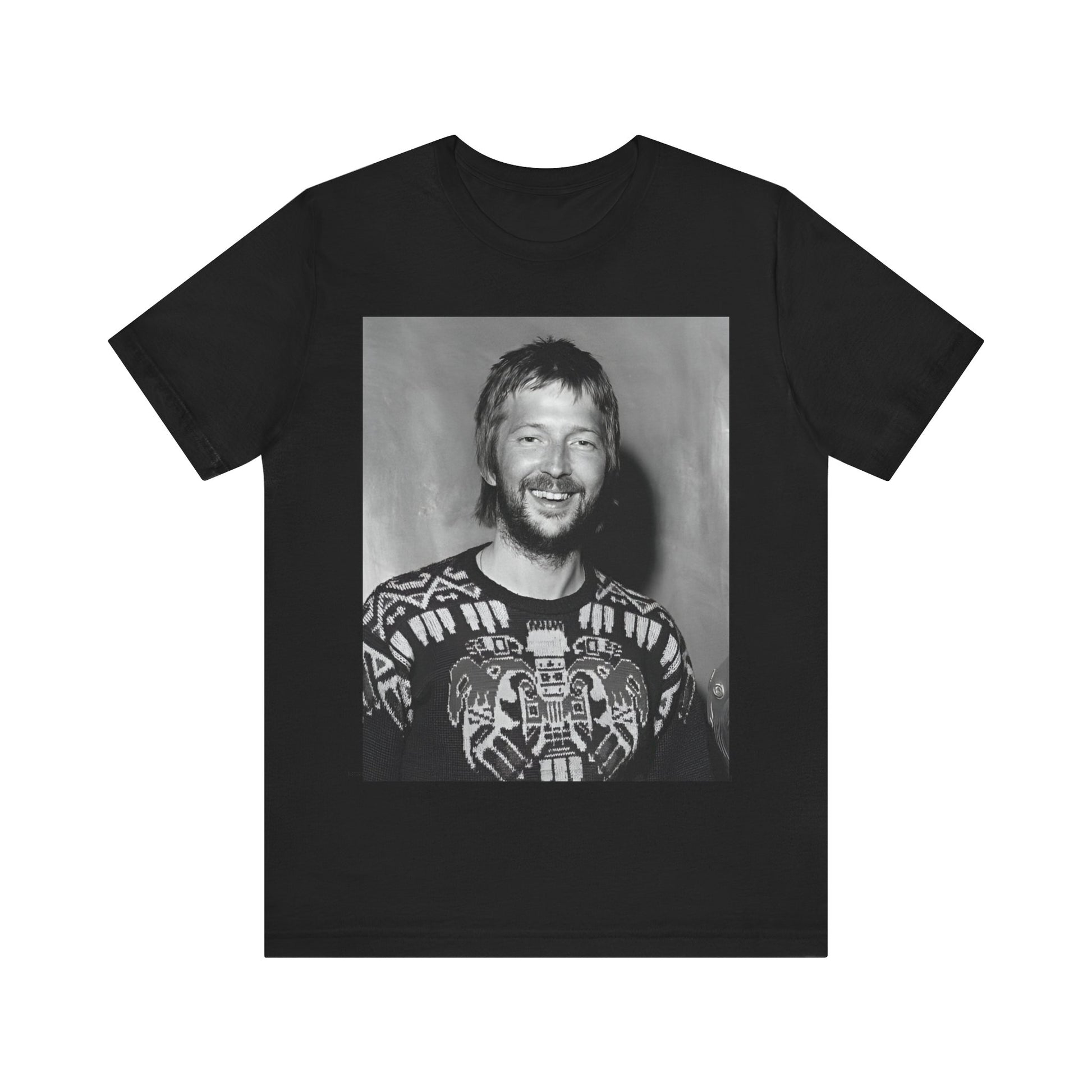 A black graphic t-shirt featuring a 70s photo portrait of Eric Clapton.
