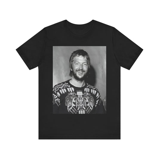 A black graphic t-shirt featuring a 70s photo portrait of Eric Clapton.