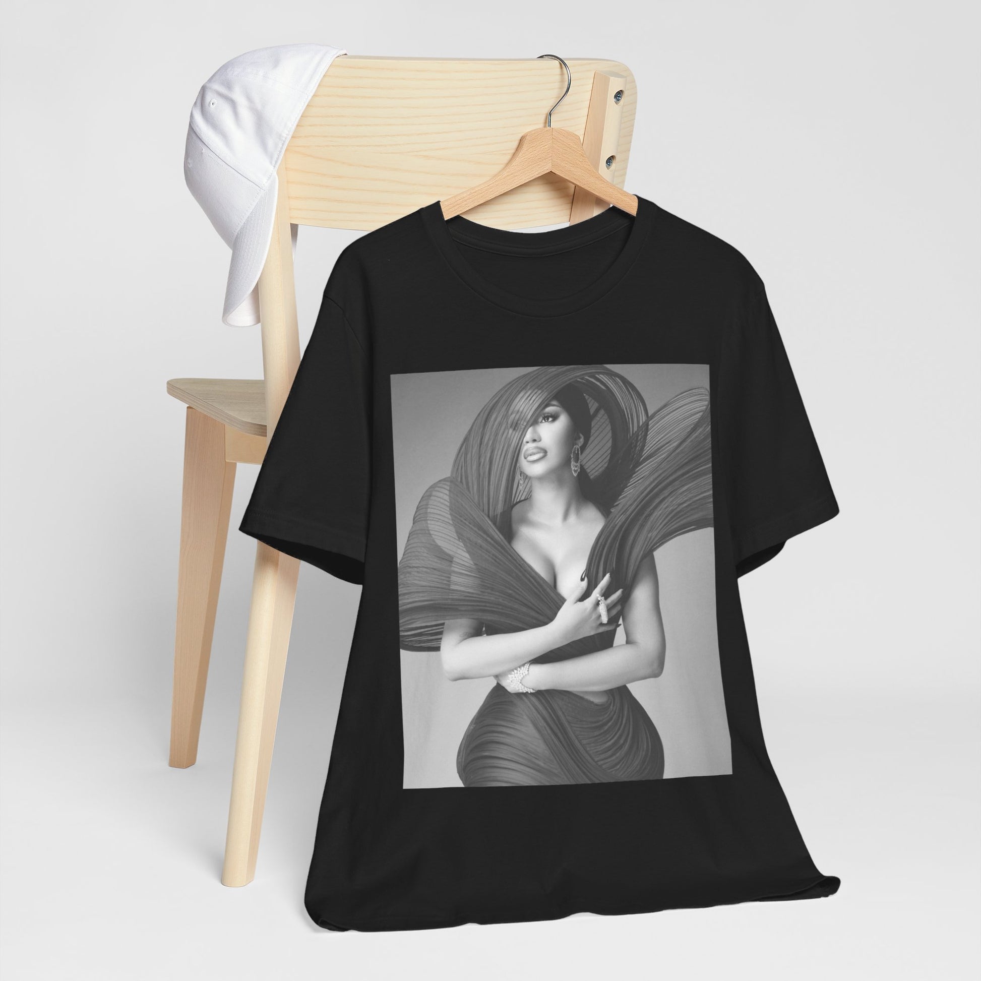A black graphic t-shirt featuring a black and white graphic of Cardi B, emphasizing her 'Bronx Princess' or rap icon status.