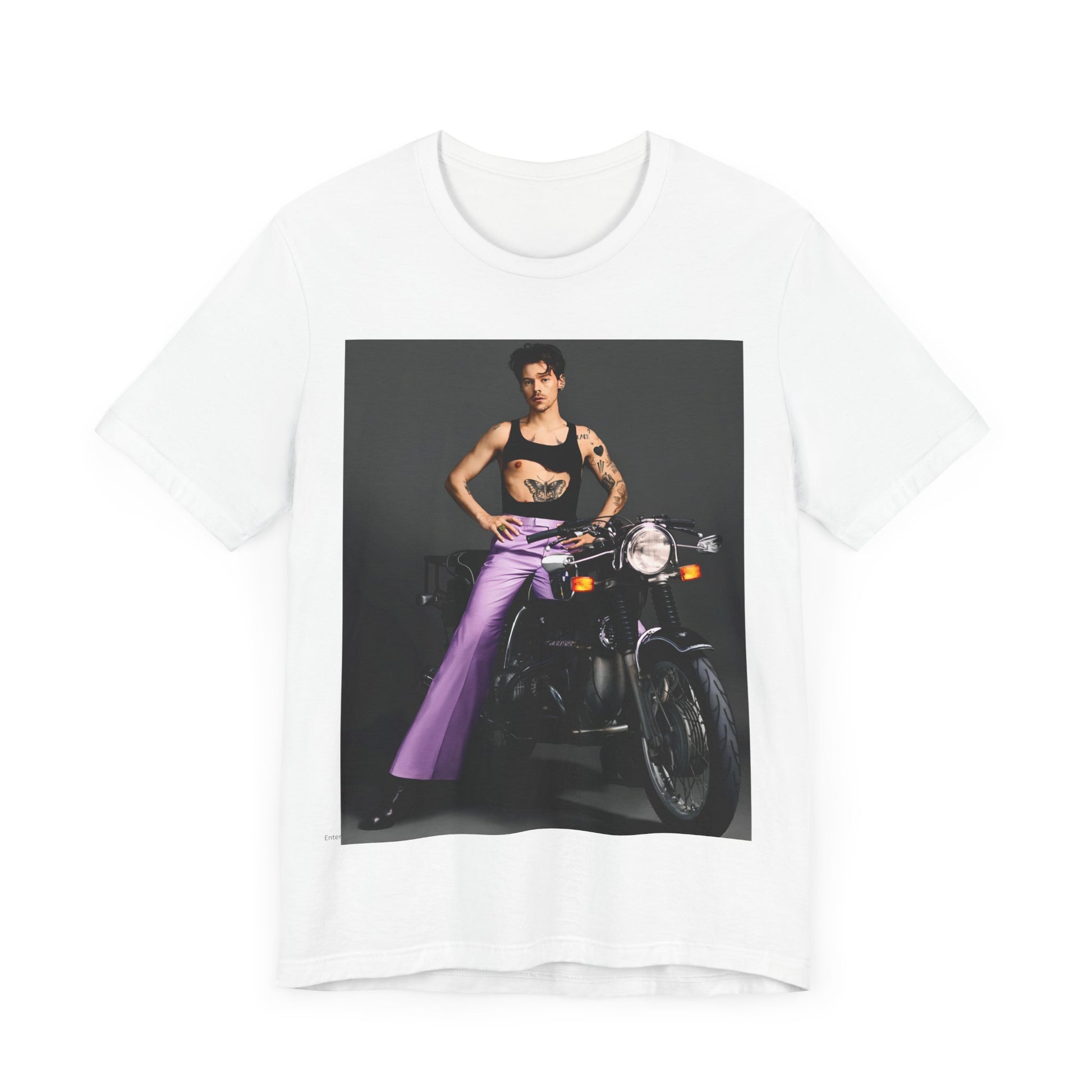 A black graphic t-shirt featuring a graphic of Harry Styles related to motorcycles or a rebellious, cool style.