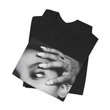 A black graphic t-shirt featuring a black and white, monochrome graphic or photo of Tinashe.