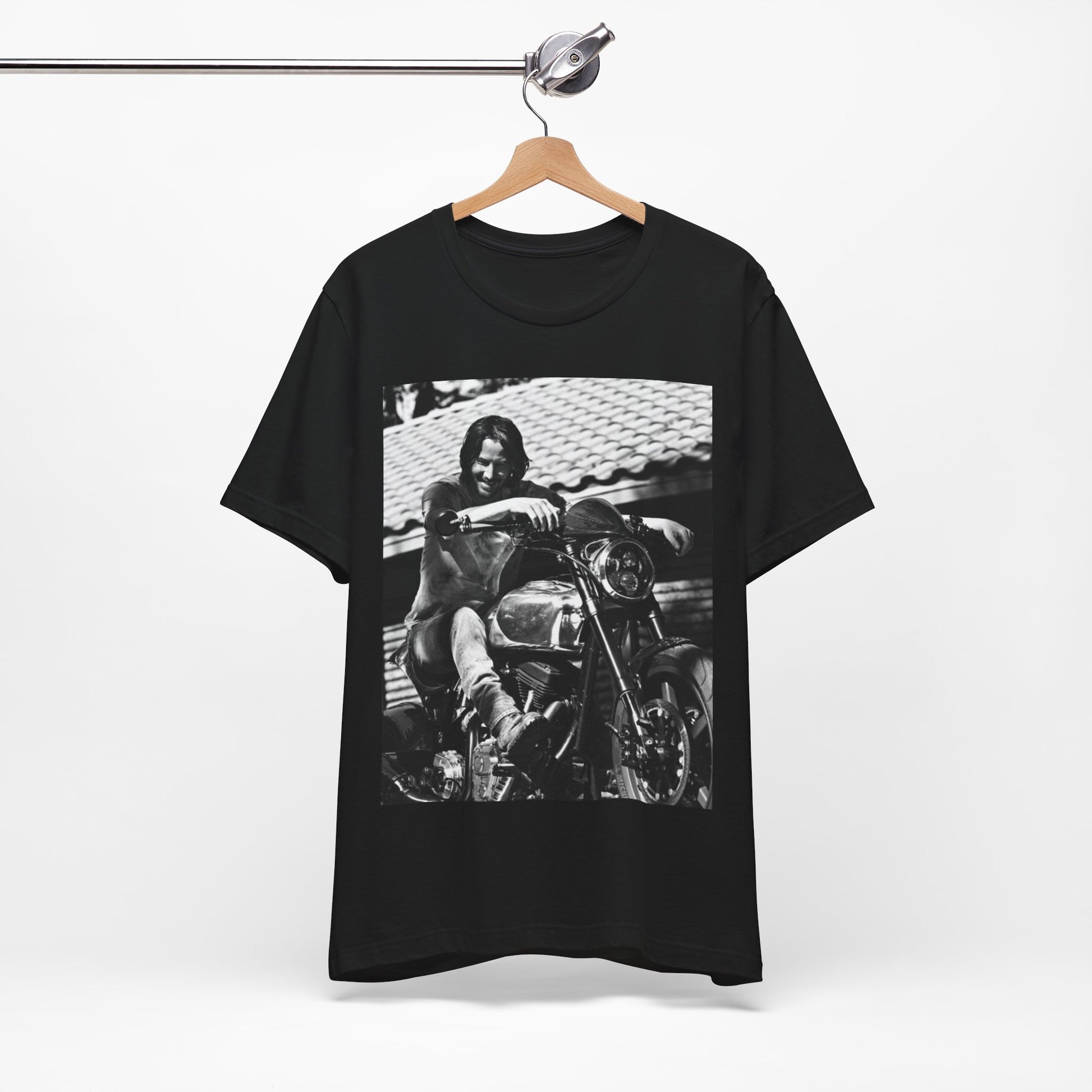 A black graphic t-shirt featuring a black and white photo of Keanu Reeves on a motorcycle.