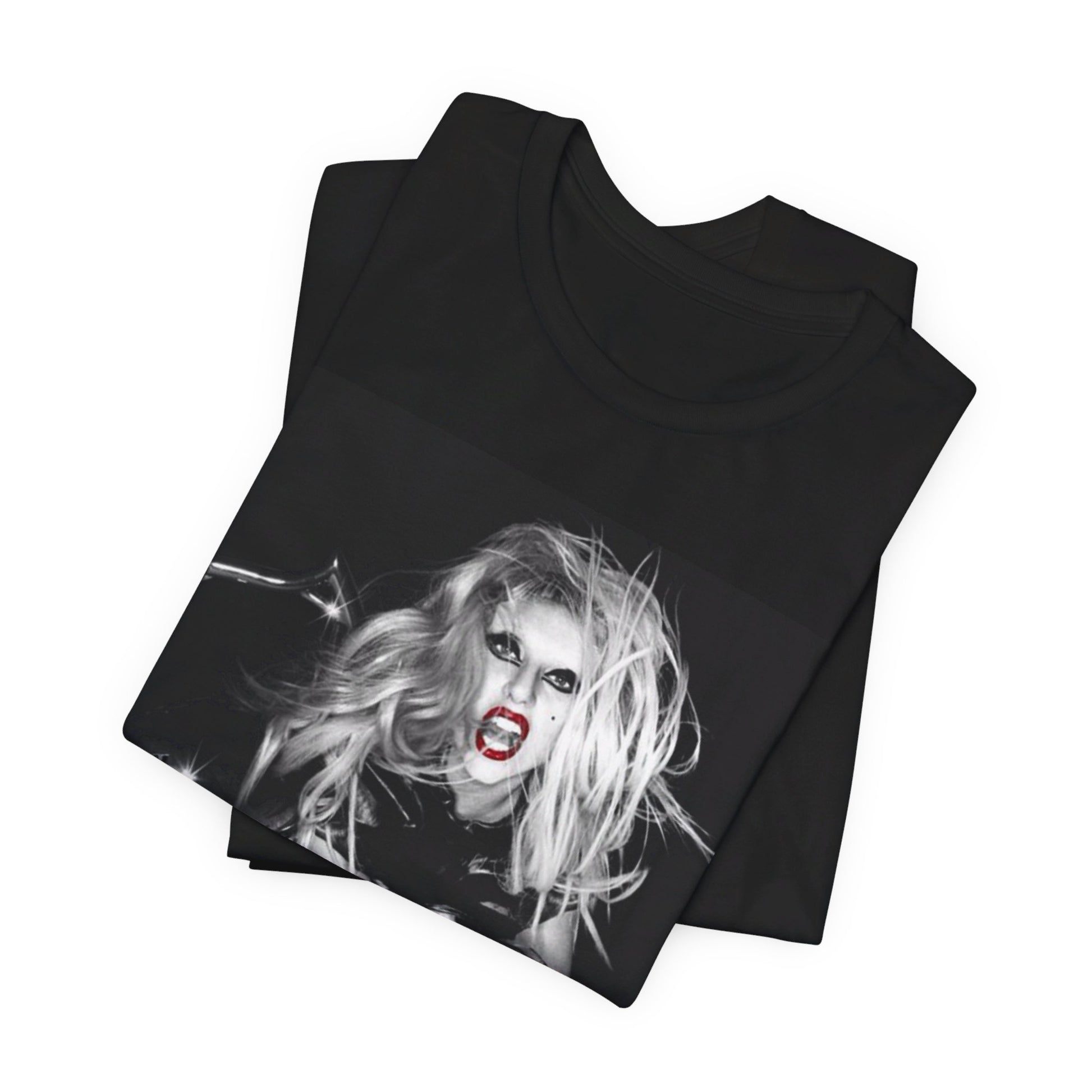 A black graphic t-shirt featuring a vintage black and white pop icon graphic of Lady Gaga.