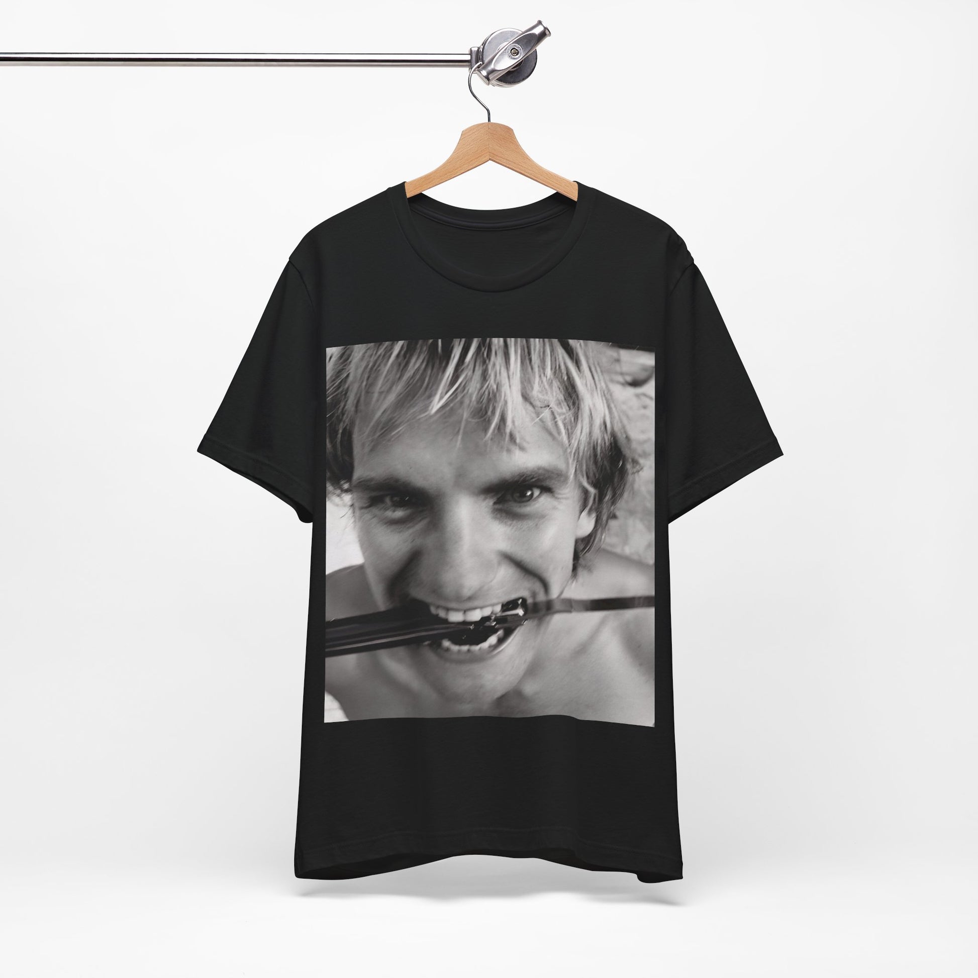 A black graphic t-shirt featuring a wild photo graphic of Sting.