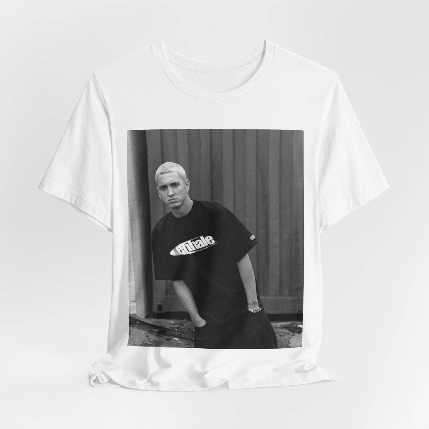 A black graphic t-shirt featuring a graphic of Eminem with a Detroit hip hop aesthetic.