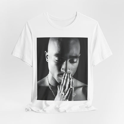 A black graphic t-shirt featuring a black and white streetwear rebel graphic of Tupac.