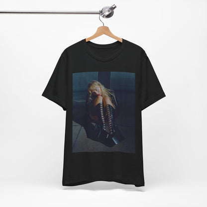 A black graphic t-shirt featuring a bold graphic of Sabrina Carpenter as a pop superstar.