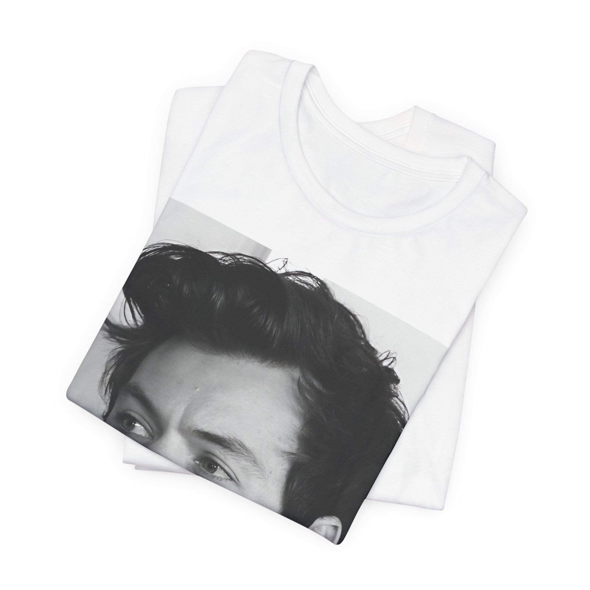 A black graphic t-shirt featuring a black and white, monochrome graphic or photo of Harry Styles.