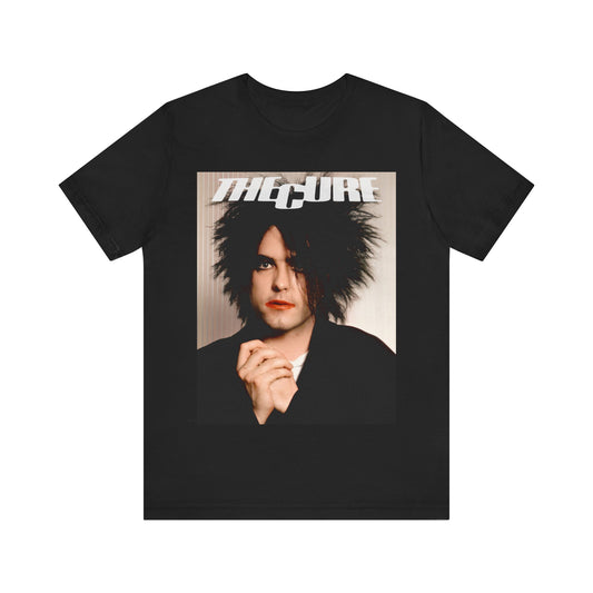 A black graphic t-shirt featuring a 90s portrait photo of Robert Smith from The Cure.