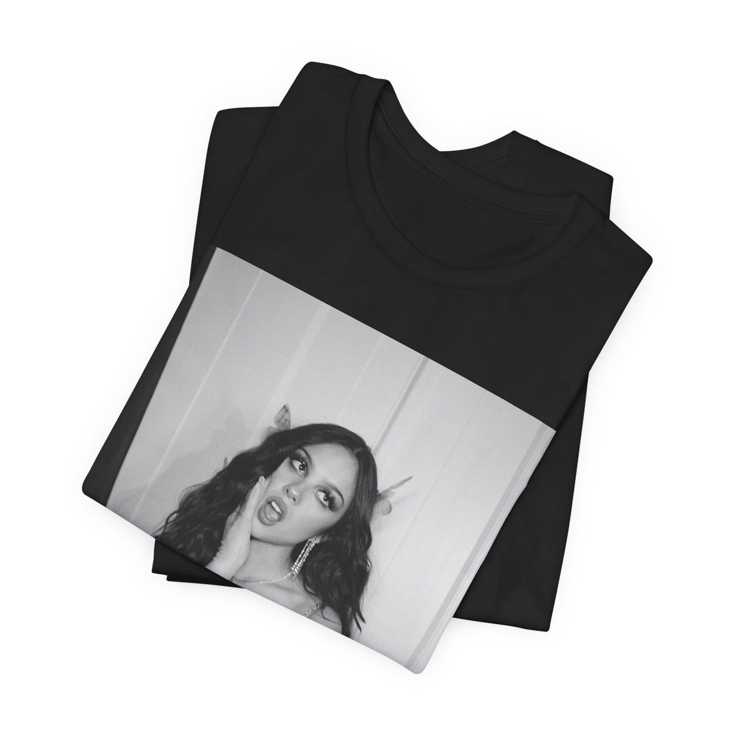 A black graphic t-shirt featuring a black and white, monochrome graphic or photo of Olivia Rodrigo.