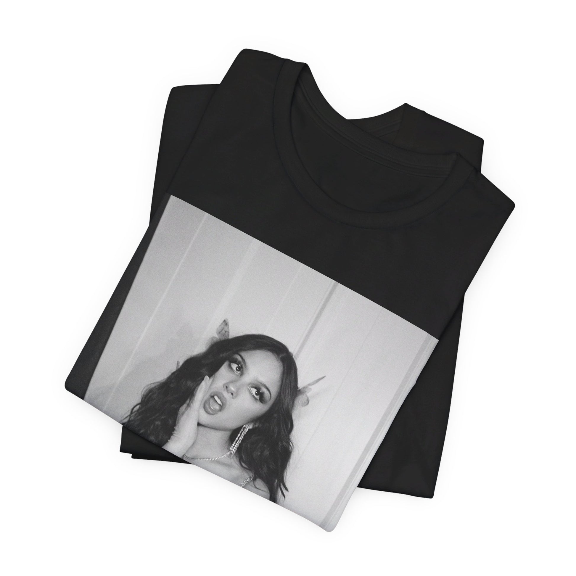 A black graphic t-shirt featuring a black and white, monochrome graphic or photo of Olivia Rodrigo.