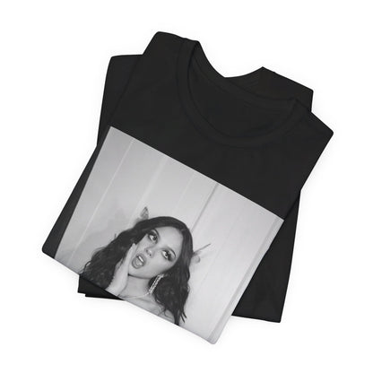 A black graphic t-shirt featuring a black and white, monochrome graphic or photo of Olivia Rodrigo.