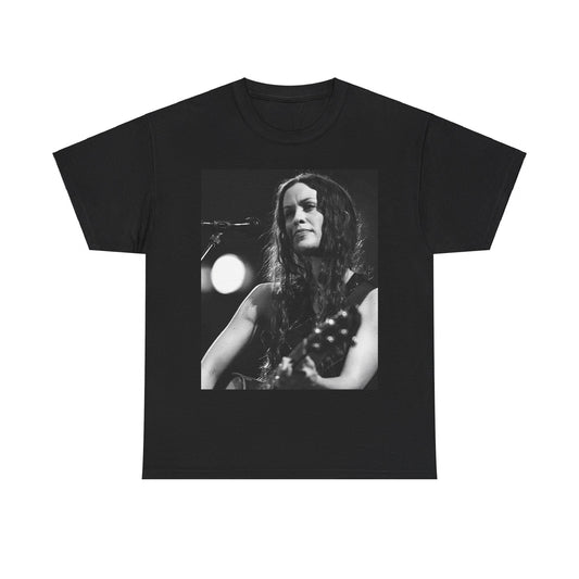 A black graphic t-shirt featuring a 90s-style graphic of Alanis Morissette playing a guitar, with a dynamic expression.