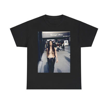 A black graphic t-shirt featuring a 90s-style graphic of Alanis Morissette with New York City elements or skyline in the background.