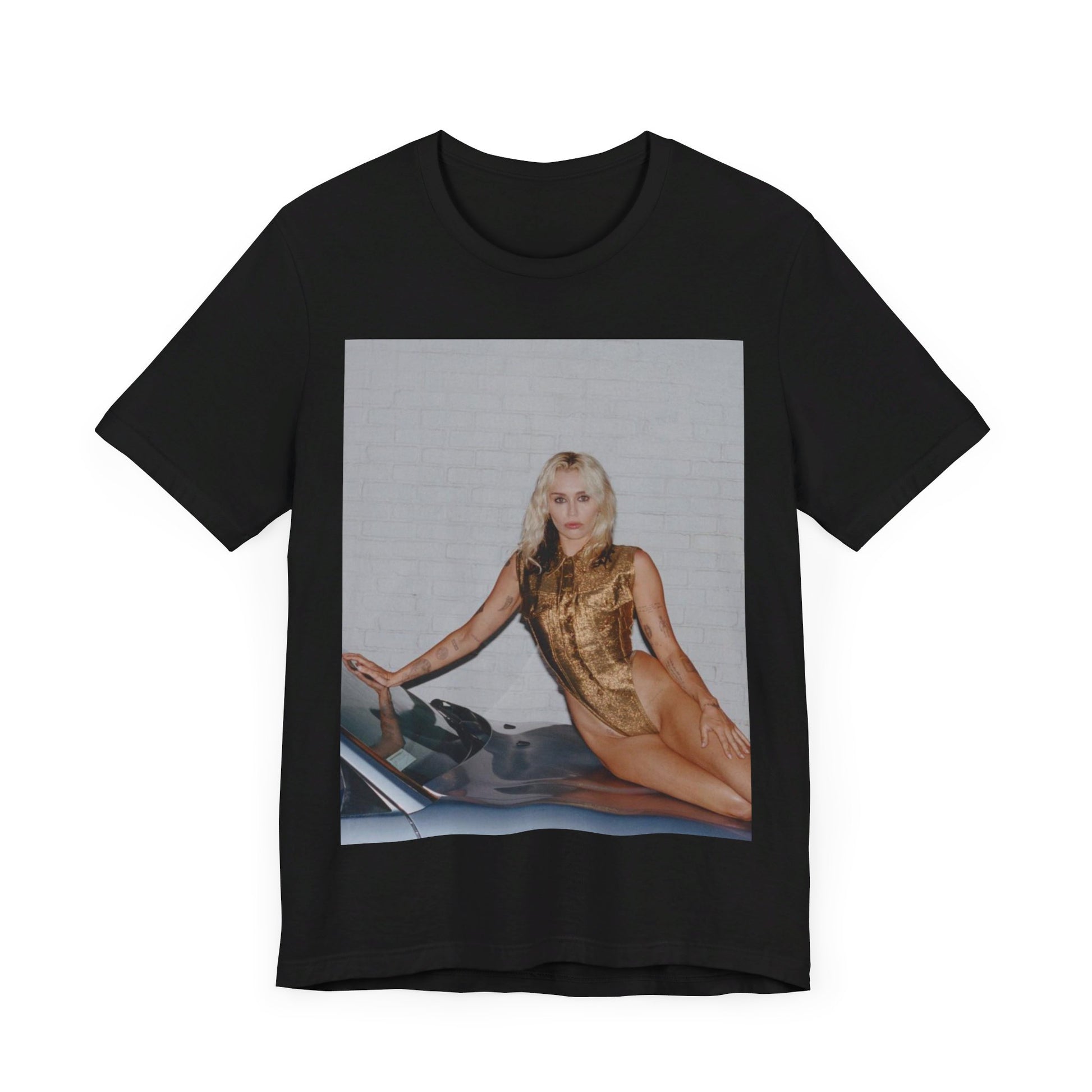 A black graphic t-shirt featuring an iconic fashion graphic of Miley Cyrus.