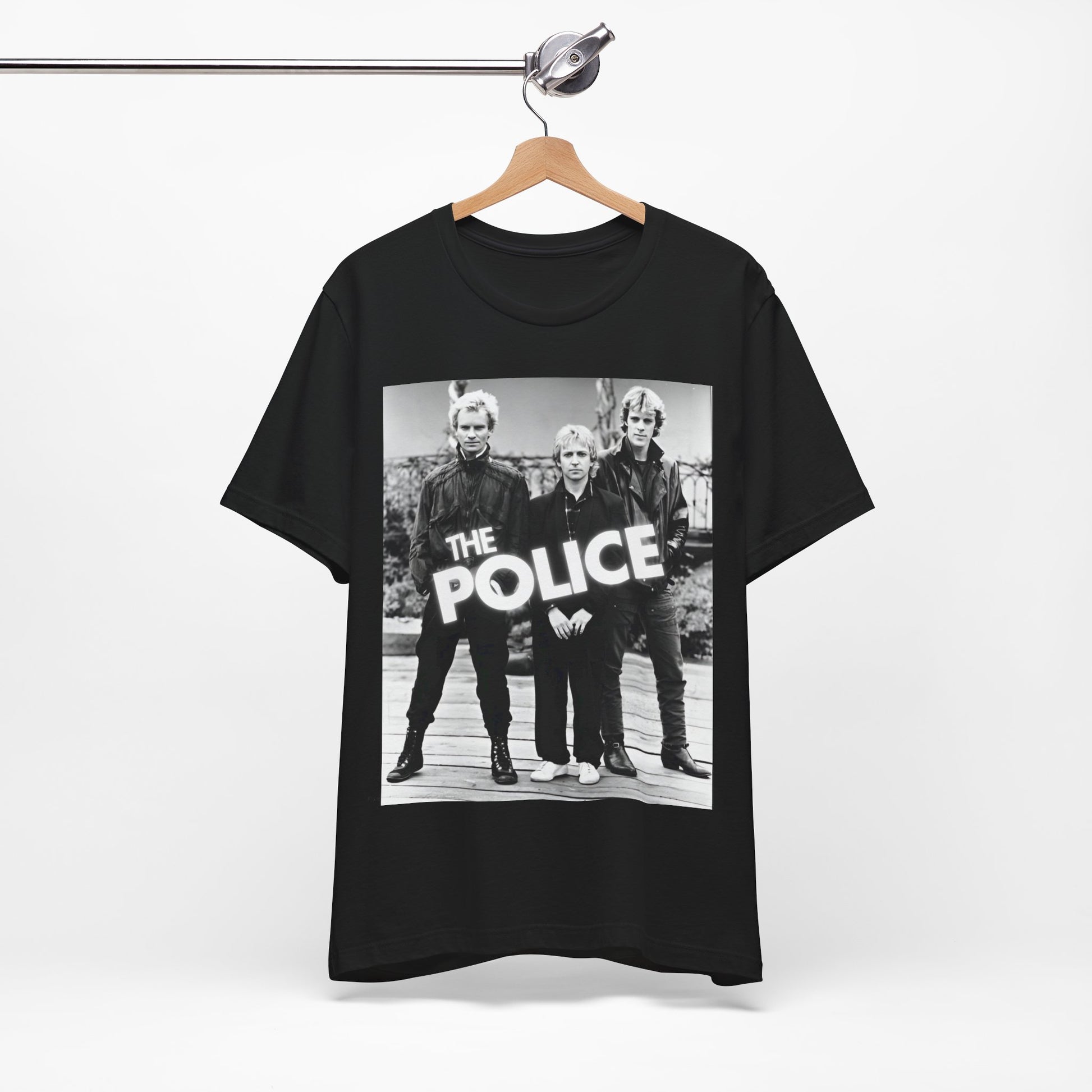 A black graphic t-shirt featuring an 80s pop rock aesthetic black and white graphic of The Police.