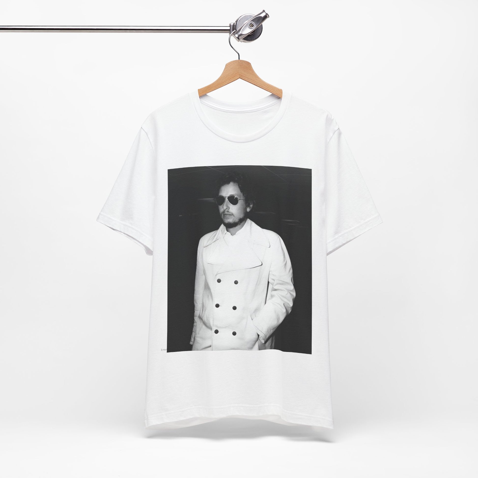 A black graphic t-shirt featuring a vintage black and white photo of Bob Dylan in a contemplative or iconic pose.