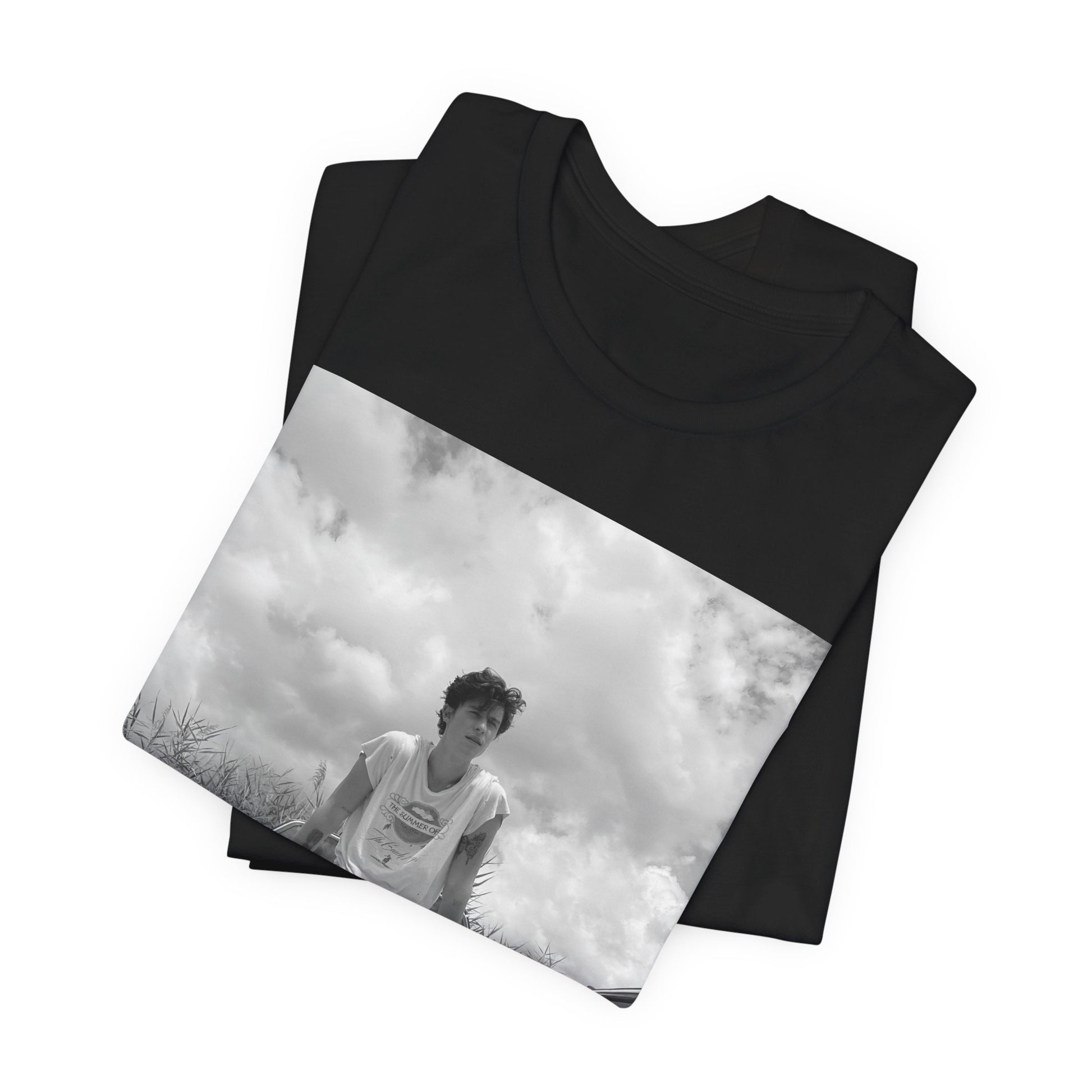 A black graphic t-shirt featuring a graphic of Shawn Mendes in an iconic tank top look.