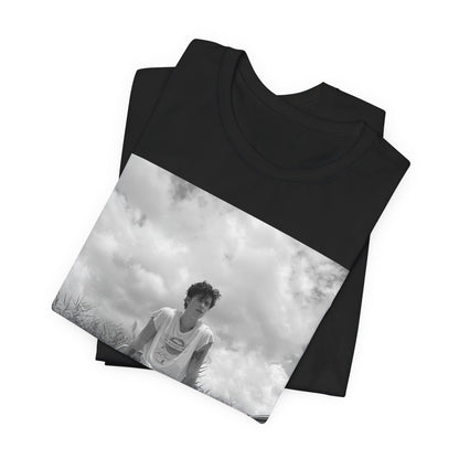 A black graphic t-shirt featuring a graphic of Shawn Mendes in an iconic tank top look.