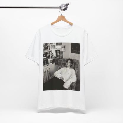 A black graphic t-shirt featuring a black and white portrait photo of Jimin.